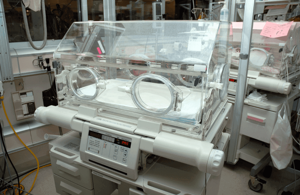An incubator for newborn babies in a hospital setting.