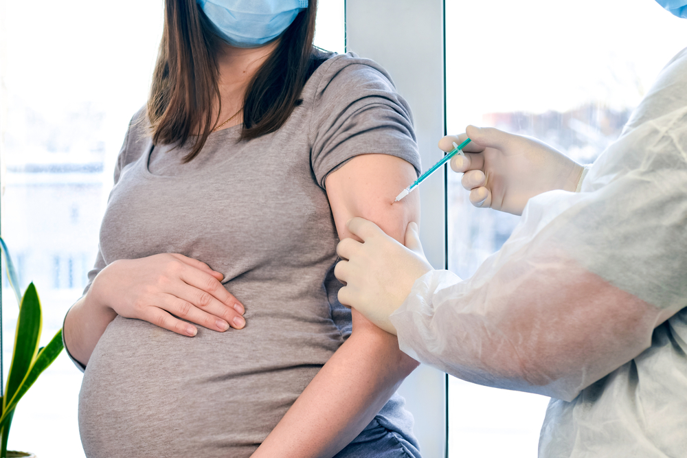 Pregnant woman receiving vaccine