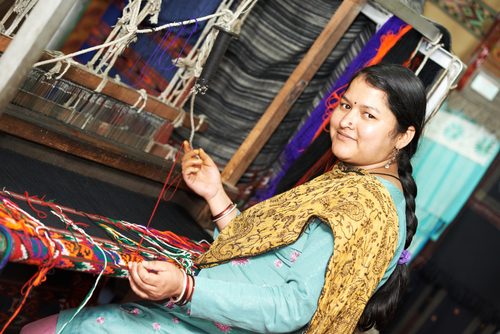 Woman working on a loom