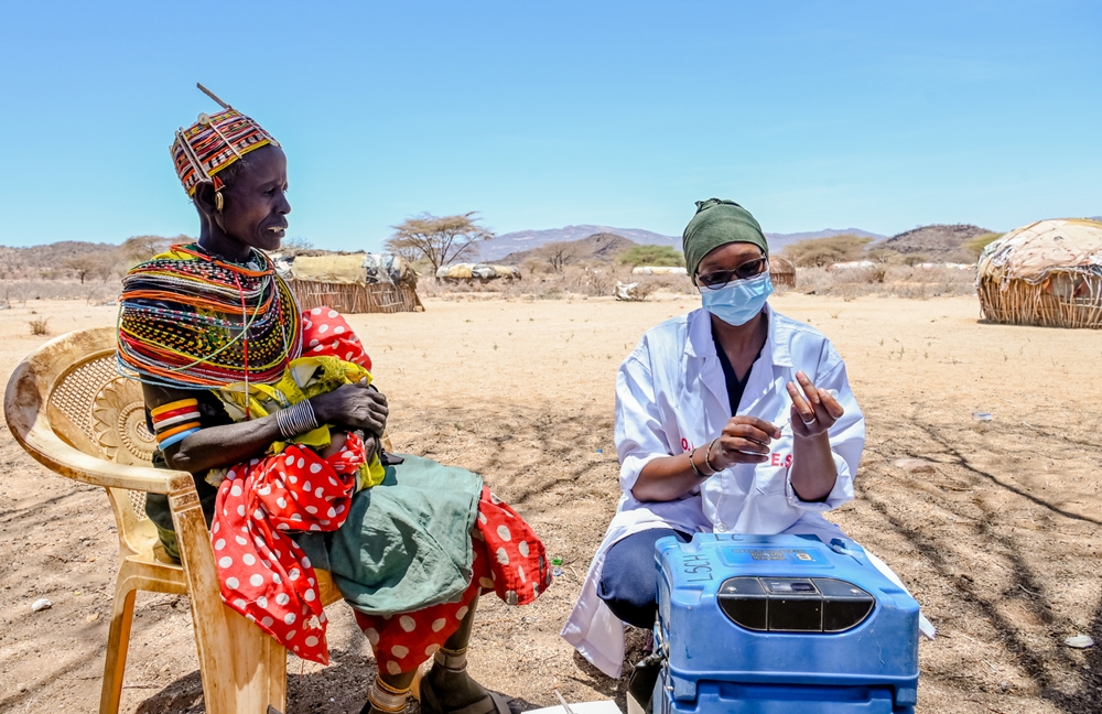 Person in Kenya receiving vaccine