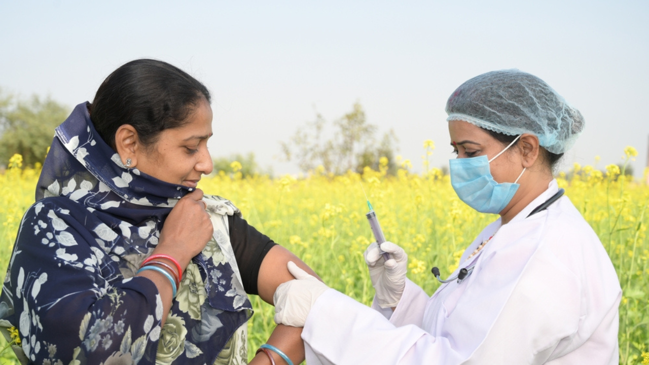 A woman in India receiving vaccination